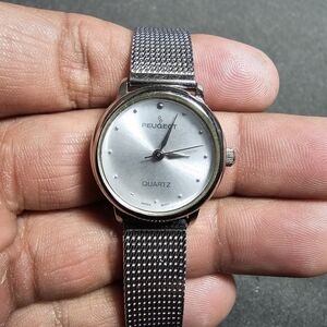 Peugeot Ladies Quartz Fashion Watch Silver Tone Working Mesh Strap shows signs o